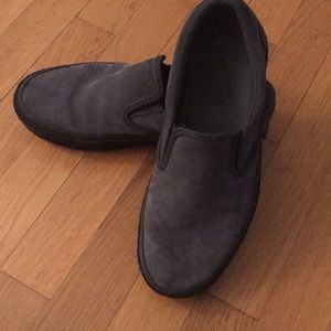 Black and gray platform slip on vans